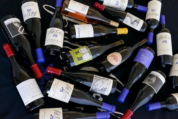 jeff-cohn-cellars-bottles-of-wine-on-their-sides-scattered-on-a-table
