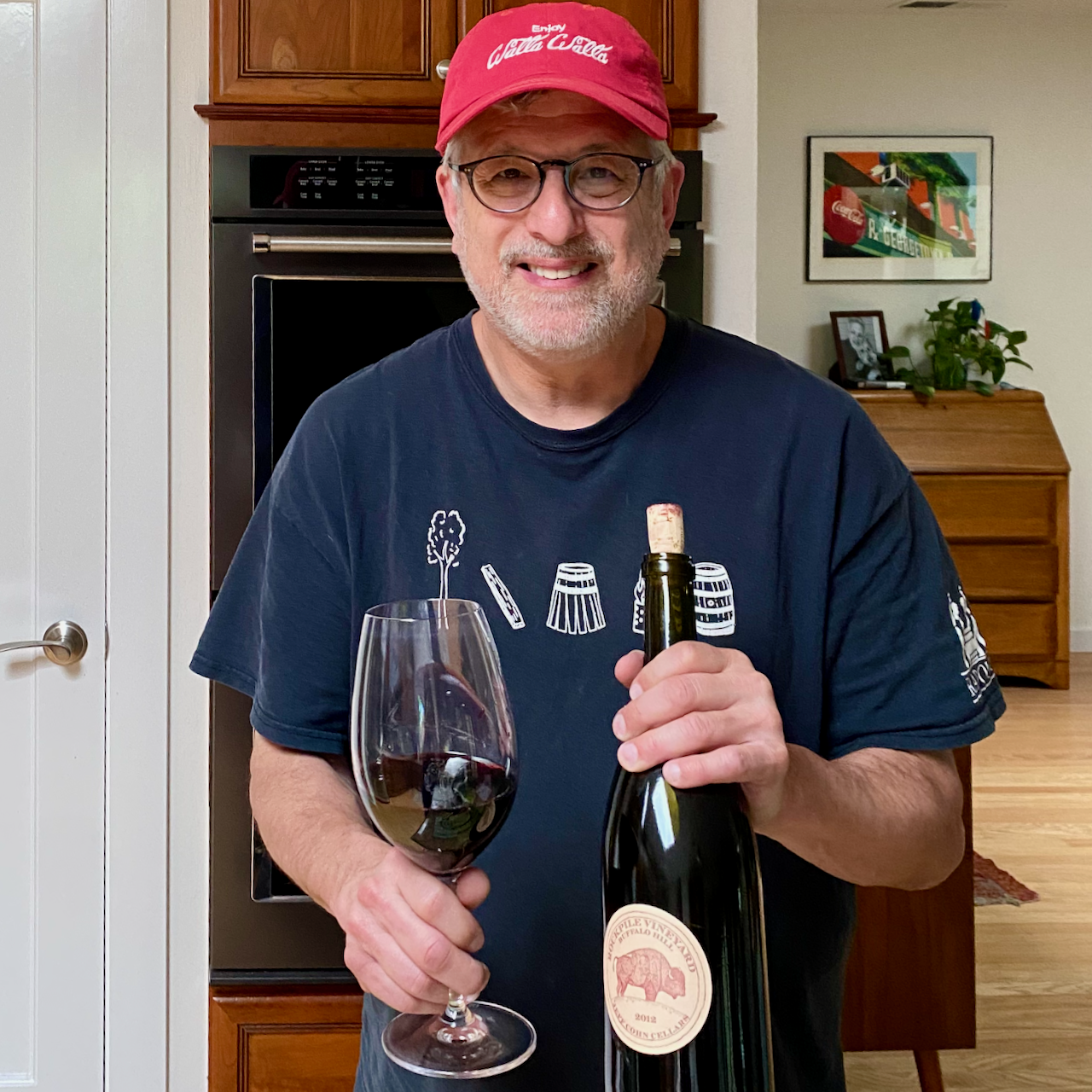 Vintner Jeff Cohn enjoys a glass of his 2012 Buffalo Hill Syrah at home.