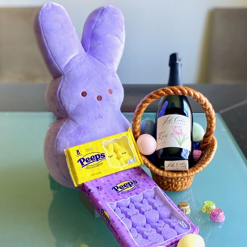 Iris Bubbly and Peeps on a table with a stuffed purple peep bunny
