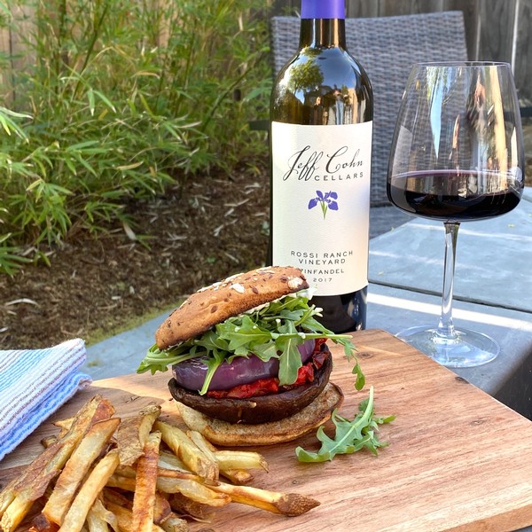 portobello burger paired with homemade fries and Jeff Cohn Cellars Rossi Zinfandel on an outdoor table