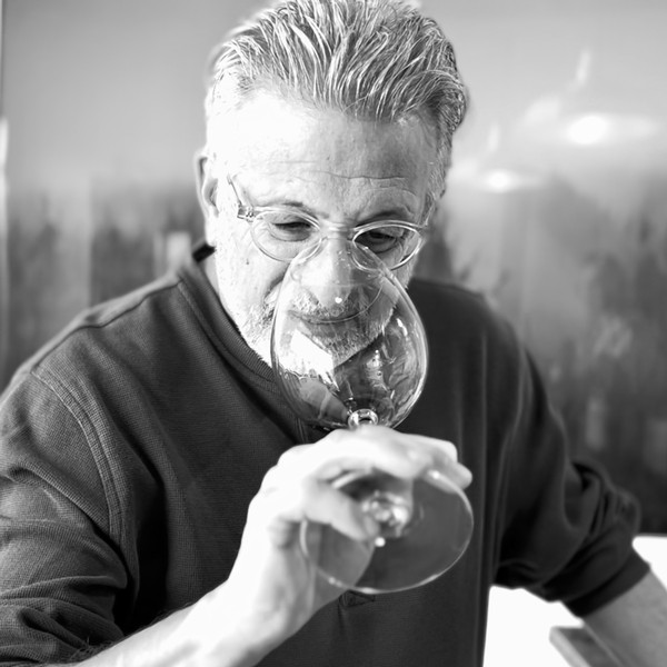 jeff cohn smelling the aromas in the glass of an iron hill vineyard zinfandel