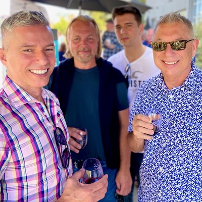 smiling club members at harvest paella event