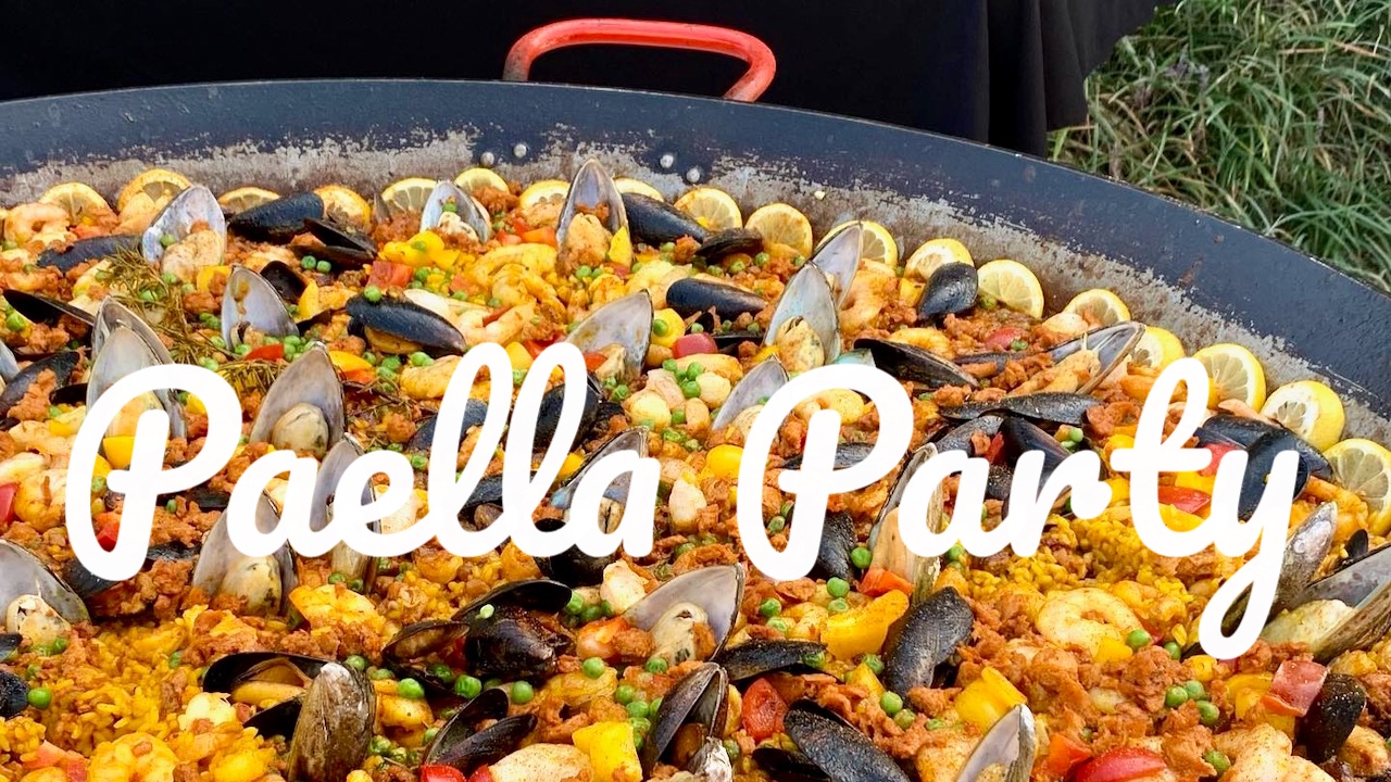 Valencia paella cooking in a giant pan at winery event