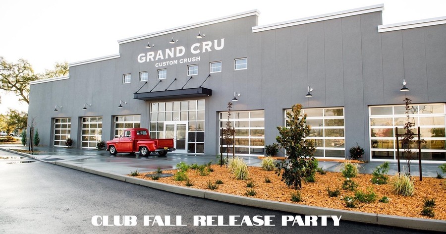a red truck in front of the Grand Cru crush facility